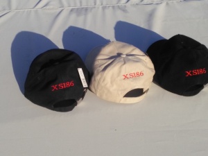 Same caps from rear aspect with XS186 embroidered in red 